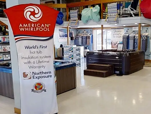 American Whirlpool spa display at Paquette Pools store with expert product guidance